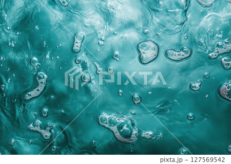 Top view of ocean surface with white sea foam and sun reflections. Clear turquoise water. Natural texture. Clean and refreshing summer atmosphere. Perfect for backgrounds and nature concepts. Banner Top view of ocean surface with white sea foam and sun reflections. Clear turquoise water. Natural texture. Clean and refreshing summer atmosphere. Perfect for backgrounds and nature concepts. Banner 127569542