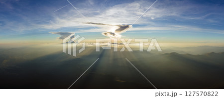 Beautiful mountain panoramic landscape with hazy peaks and foggy valley at sunset 127570822