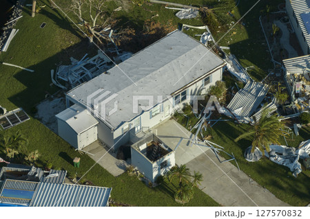 Badly damaged mobile homes after hurricane Ian in Florida residential area. Consequences of natural disaster Badly damaged mobile homes after hurricane Ian in Florida residential area. Consequences of natural disaster 127570832