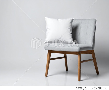 Gray Fabric Chair with White Pillow on Wooden Legs 127570967