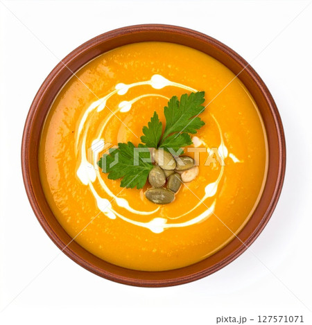 Creamy Pumpkin Soup in Rustic Bowl with Parsley Garnish 127571071