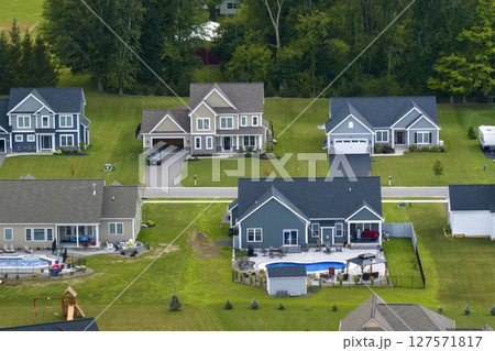 Aerial view of spacious new family houses in upstate New York suburban area. Real estate development in american suburbs 127571817