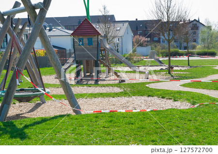 Empty closed playground for children. Coronavirus in Europa. Empty closed playground for children. Coronavirus in Europa. 127572700