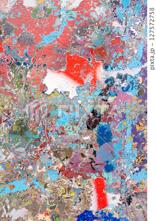 Abstract textured painting with vibrant splashes of red, blue, and gold. A visually rich composition 127572758