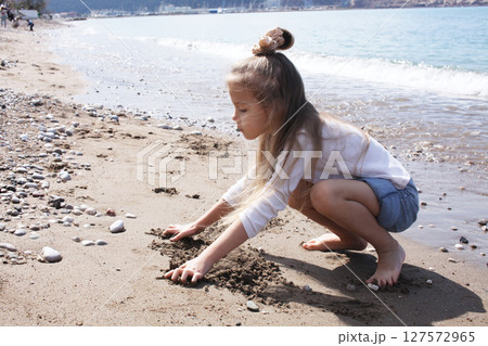little cute girl on beach, lifestyle people concept little cute girl on beach, lifestyle people concept 127572965