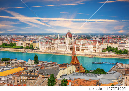 Budapest skyline with Hungarian Parliament and Calvinist church on the Danube Budapest skyline with Hungarian Parliament and Calvinist church on the Danube 127573095