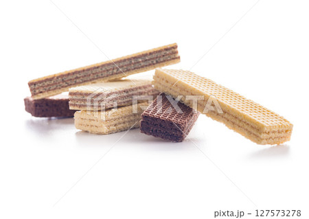 Sweet wafers filled with chocolate and vanilla cream isolated on white background. 127573278