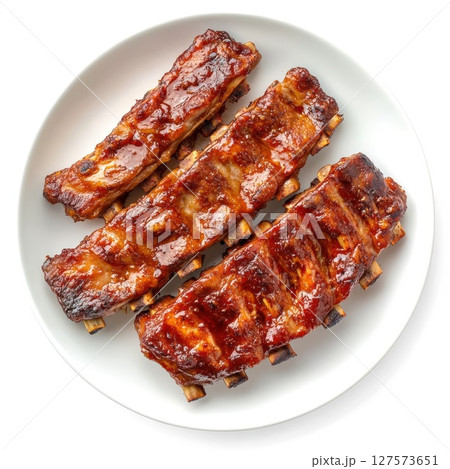 Mouthwatering BBQ Pork Ribs. Perfectly Glazed and Tender, Coated in Rich Barbecue Sauce A Delicious and Savory Culinary Delicacy on White Plate Mouthwatering BBQ Pork Ribs. Perfectly Glazed and Tender, Coated in Rich Barbecue Sauce A Delicious and Savory Culinary Delicacy on White Plate 127573651