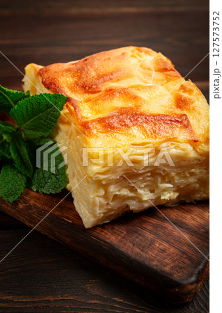 Achma, khachapuri, Georgian cuisine, homemade, no people, on a wooden background, 127573752