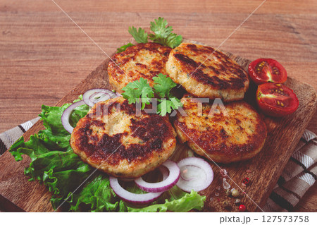 fried chicken cutlets, minced chicken, with vegetables, on a cutting board, with vegetable salad, top view, homemade, no people, fried chicken cutlets, minced chicken, with vegetables, on a cutting board, with vegetable salad, top view, homemade, no people, 127573758
