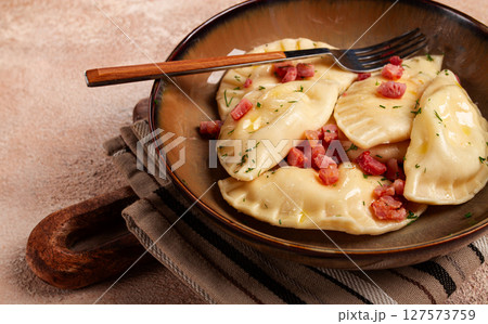 Dumplings, with fried prosciutto, a traditional dish of Polish cuisine, dumplings, top view, close-up, without people, Dumplings, with fried prosciutto, a traditional dish of Polish cuisine, dumplings, top view, close-up, without people, 127573759