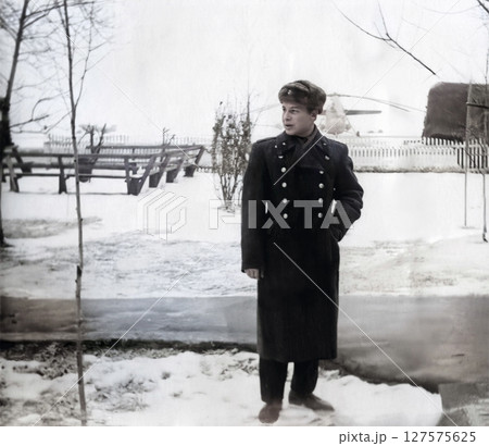Vintage portrait of a young lieutenant of the medical troops of the Soviet army during winter exercises. Retro photo from 1964. 127575625