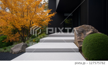 Modern home entrance with Zen inspired landscaping 127575782