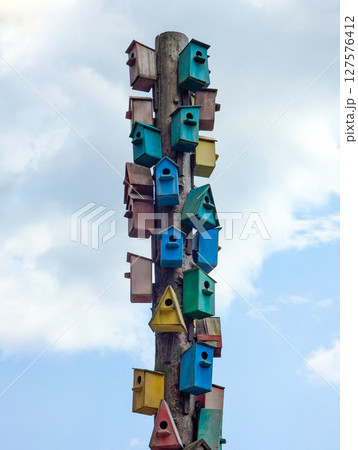 Lots of colorful wooden birdhouses Lots of colorful wooden birdhouses 127576412