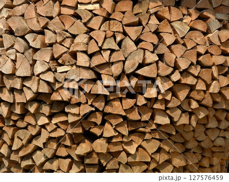 Cross-section background of a large number of firewood piles 127576459