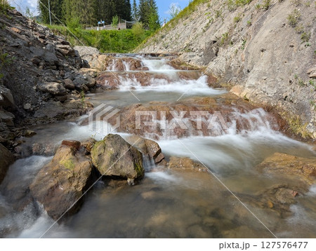mountain river with a waterfall mountain river with a waterfall 127576477