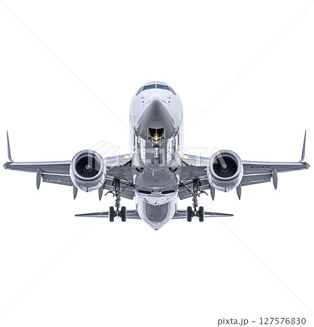 Commercial airplane is captured in front view, showcasing its engines and landing gear. image highlights aircraft sleek design and engineering precision, emphasizing its readiness for flight 127576830