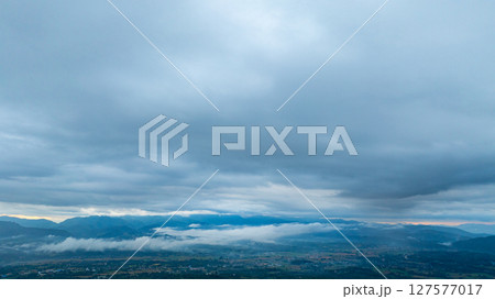 Aerial view of Cloud-Covered Mountain Peak Aerial view of Cloud-Covered Mountain Peak 127577017