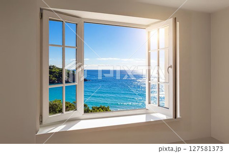 開いた窓から海を望む白い部屋　オーシャンビューの爽やかな景色 127581373