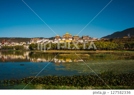 Songzanlin Monastery Reflecting in a Tranquil Lake in Shangri la 127582336