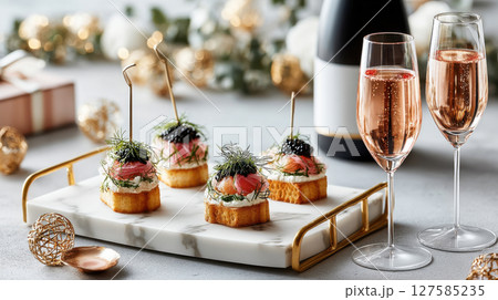 Delight in this premium food display featuring elegant appetizers and sparkling drinks perfect for celebrations Delight in this premium food display featuring elegant appetizers and sparkling drinks perfect for celebrations 127585235
