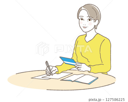 通帳をみながら書類に記入する中高年女性 通帳をみながら書類に記入する中高年女性 127586225
