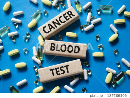 Cancer Blood Test symbol. Concept word Cancer Blood Test on wooden blocks. Beautiful blue background with pills. Medicine and Cancer Blood Test concept. Copy space Cancer Blood Test symbol. Concept word Cancer Blood Test on wooden blocks. Beautiful blue background with pills. Medicine and Cancer Blood Test concept. Copy space 127586306