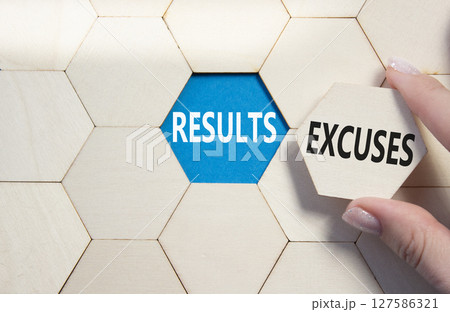 Results or Excuses symbol. Concept word Results or Excuses on wooden comb puzzle. Businessman hand. Beautiful blue background. Business and Results or Excuses concept. Copy space 127586321