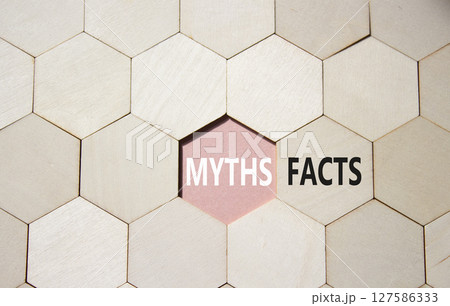 Facts or Myths symbol. Concept word Facts or Myths on wooden comb puzzle. Beautiful pink background. Business and Facts or Myths concept. Copy space Facts or Myths symbol. Concept word Facts or Myths on wooden comb puzzle. Beautiful pink background. Business and Facts or Myths concept. Copy space 127586333