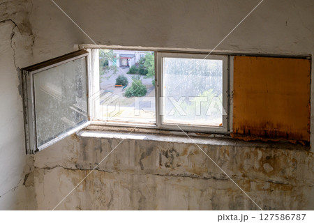 interior of dirty wall in old house with wooden windows 127586787