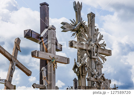 Wooden Crosses Against Dramatic Cloudy Sky at Lithuania Hill of Crosses Landmark Wooden Crosses Against Dramatic Cloudy Sky at Lithuania Hill of Crosses Landmark 127589720