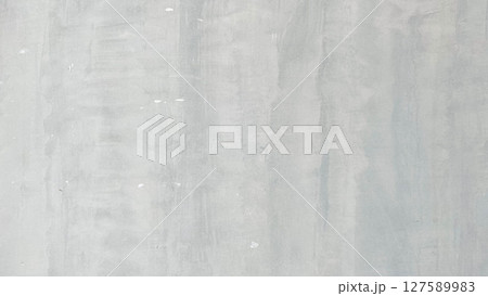 Light grey cement wall with vertical brush patterns and natural texture. Perfect for use as a neutral minimalist background or industrial interior design element. Light grey cement wall with vertical brush patterns and natural texture. Perfect for use as a neutral minimalist background or industrial interior design element. 127589983