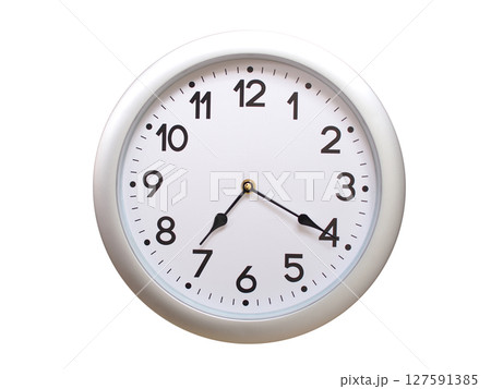 Round Silver Wall Clock Showing 07:20 or 19:20 Isolated-White. Useful for concepts like noon, midnight, deadline, countdown, or time management. Round Silver Wall Clock Showing 07:20 or 19:20 Isolated-White. Useful for concepts like noon, midnight, deadline, countdown, or time management. 127591385