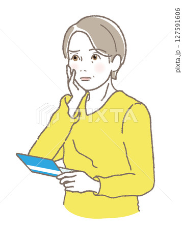 通帳をみて困った顔をする中高年女性 127591606