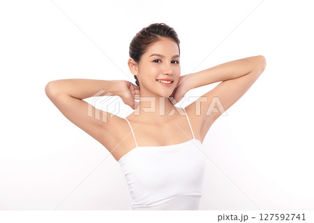 Beautiful Young Asian woman Raises her hands to Showcase clean and hygienic underarms Against a white background, Smooth armpit cleanliness and protection concept Beautiful Young Asian woman Raises her hands to Showcase clean and hygienic underarms Against a white background, Smooth armpit cleanliness and protection concept 127592741