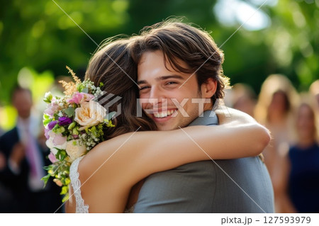 bride holding bouquet of flowers in park 127593979
