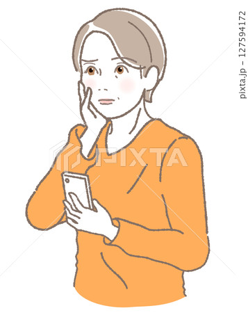 スマホを持って困った顔をしている中高年女性 127594172