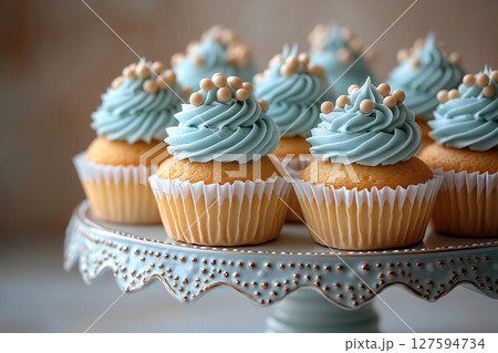Various cakes in blue tones on dessert stand with soft lighting. Various cakes in blue tones on dessert stand with soft lighting. 127594734