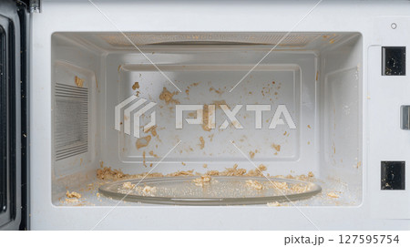汚れた電子レンジ庫内 掃除前の状態 汚れた電子レンジ庫内 掃除前の状態 127595754