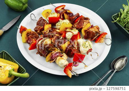Raw meat skewers, fresh, ready-to-cook. 127598751