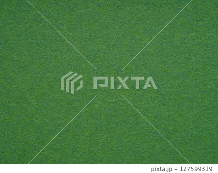 Emerald green paper surface reveals a fine fibrous texture, conjuring a sense of organic elegance Emerald green paper surface reveals a fine fibrous texture, conjuring a sense of organic elegance 127599319