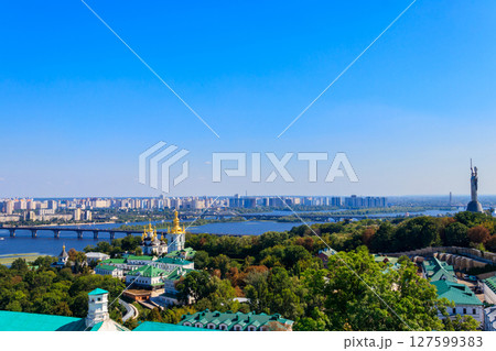 View of Kiev Pechersk Lavra (Kiev Monastery of the Caves),  Motherland Monument and the Dnieper river in Ukraine. View from Great Lavra Bell Tower 127599383