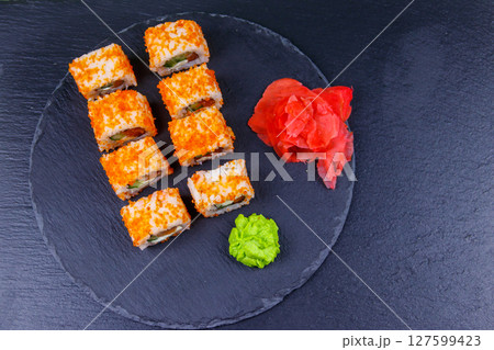 Sushi rolls Philadelphia on a black slate. Top view 127599423