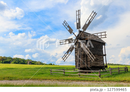 Old wooden windmill in Pyrohiv (Pirogovo) village near Kiev, Ukraine 127599465