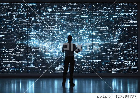 Modern Economist Analyzing Real-Time Data on Tablet in Sleek Office Setting 127599737