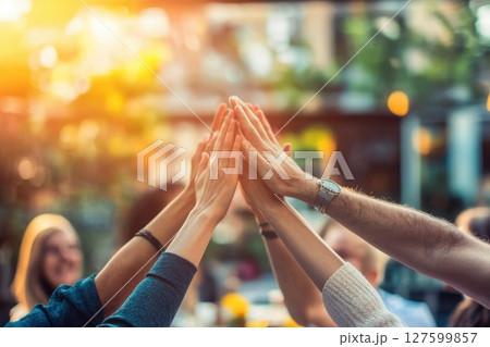 Team of Professionals Celebrating a Successful Collaboration in a Bright Outdoor Setting Team of Professionals Celebrating a Successful Collaboration in a Bright Outdoor Setting 127599857