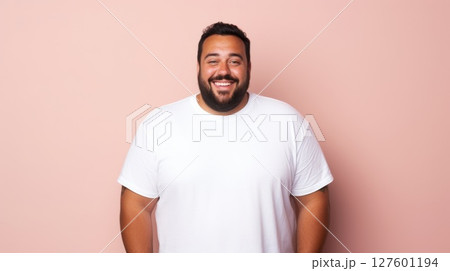 joyful young hispanic plus size body positive male man boy guy 30s in white blank design casual t-shirt posing color background studio portrait, ai 127601194