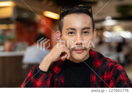 Portrait of nonbinary genderfluid young Asian gay man looking at camera 127601776