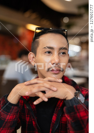 Portrait of nonbinary genderfluid young Asian gay man face 127601777