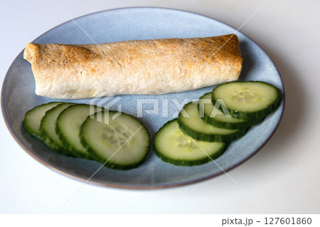 Delicious fried roll on a plate 127601860